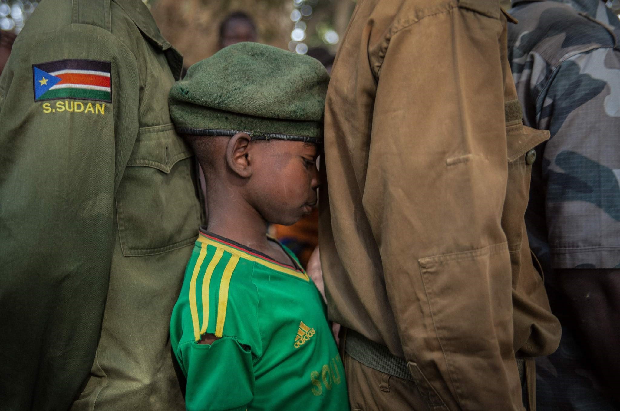 A newly released child soldier waits in a line for his registration during a ceremony in Yambio, South Sudan, Feb.7. 