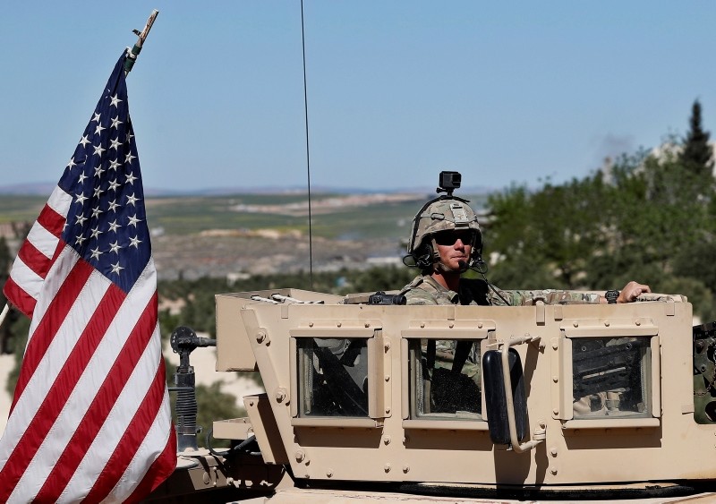 A U.S. soldier sits in his armored vehicle in Manbij, northern Syria, April 4. 