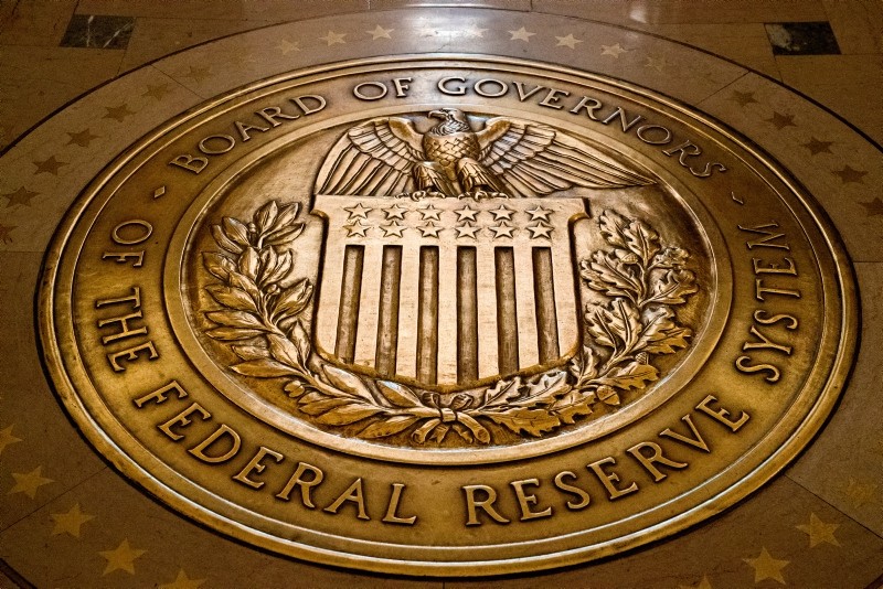 In this Feb. 5, 2018, file photo, the seal of the Board of Governors of the United States Federal Reserve System is displayed in the ground at the Marriner S. Eccles Federal Reserve Board Building in Washington. (AP Photo)