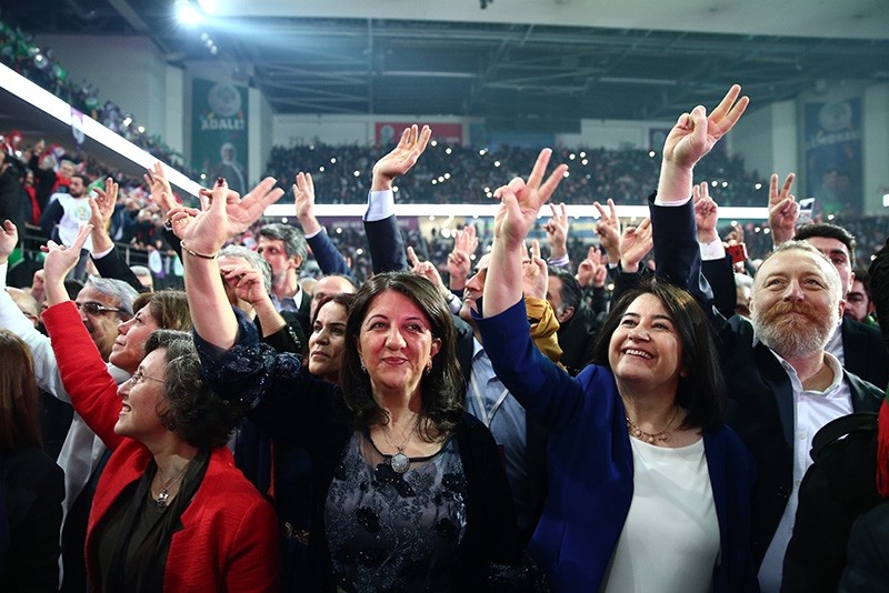 HDP Co-Chair Serpil Kemalbay (R2) and chairperson candidates Istanbul deputy Pervin Buldan and former deputy Sezai Temelli wave at supporters in Ankara Sports Arena. (AA Photo)