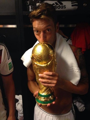 Özil with the World Cup trophy.