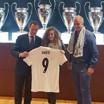 Ahed Tamimi with Real Madrid's star former striker Emilio Butragueno (L)