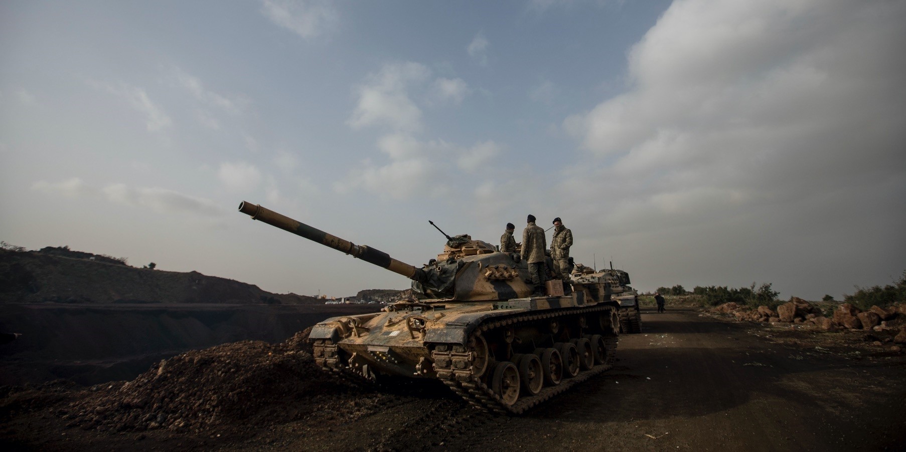Turkish soldiers prepare tanks before crossing the Syrian-Turkish border, in the Hassa district in Hatay, Jan. 22.