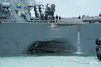 The United States Navy 7th Fleet shows the damaged hull on the port side of the United States Navy missile destroyer USS John S. McCain while berthed at the Changi Navy Base in Singapore, 21 August 2017. (EPA Photo)