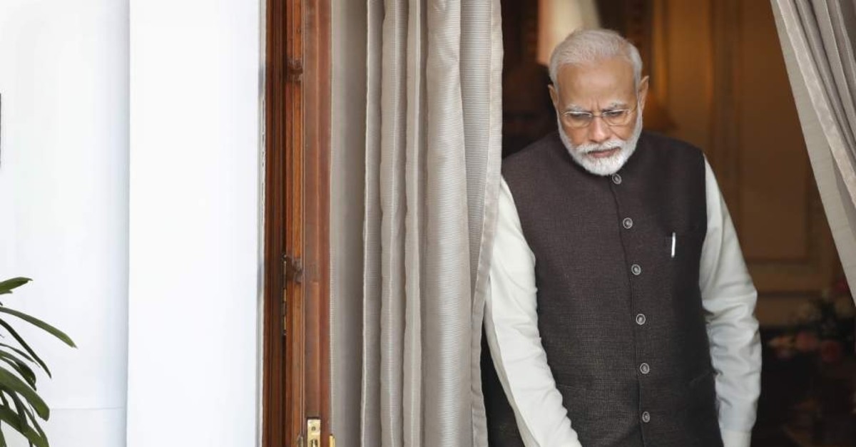 Indian Prime Minister Narendra Modi leaves the room to receive Portuguese President Marcelo Rebelo de Sousa, New Delhi, Feb. 14, 2020. (AP Photo)