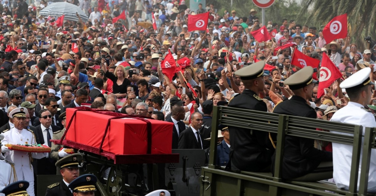 Military officers escort the coffin of late Tunisian President Beji Caid Essebsi during his funeral in Tunis, Tunisia, July 27, 2019.