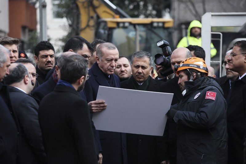 President Recep Tayyip Erdou011fan visits the building collapse site on Feb 9, 2019 in Istanbul. (AA Photo)