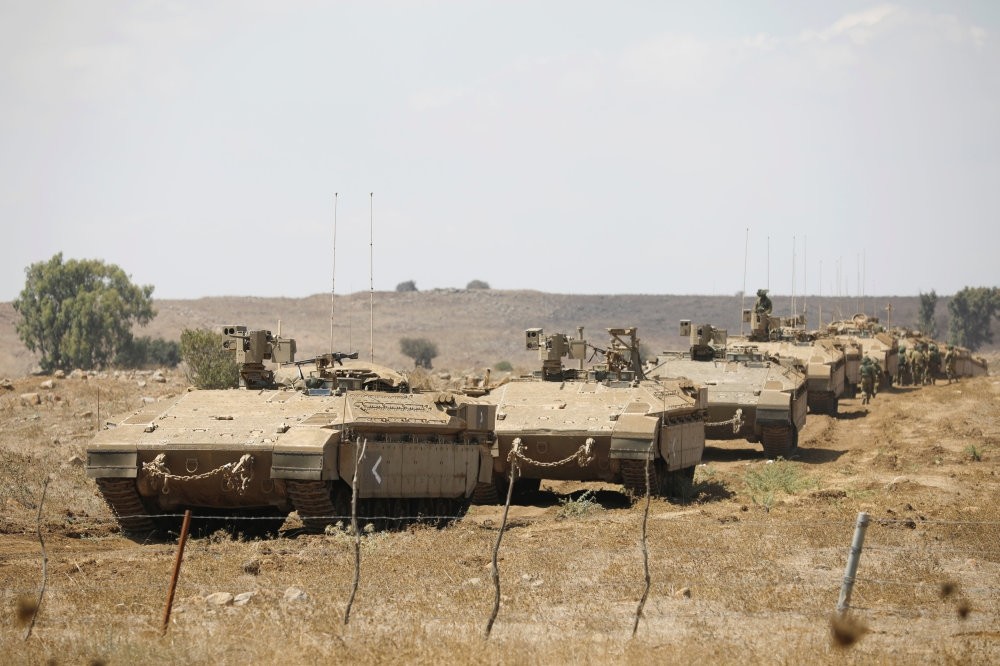 Israeli armored vehicles take part in a military drill in the Israeli-occupied Golan Heights, Aug. 7.
