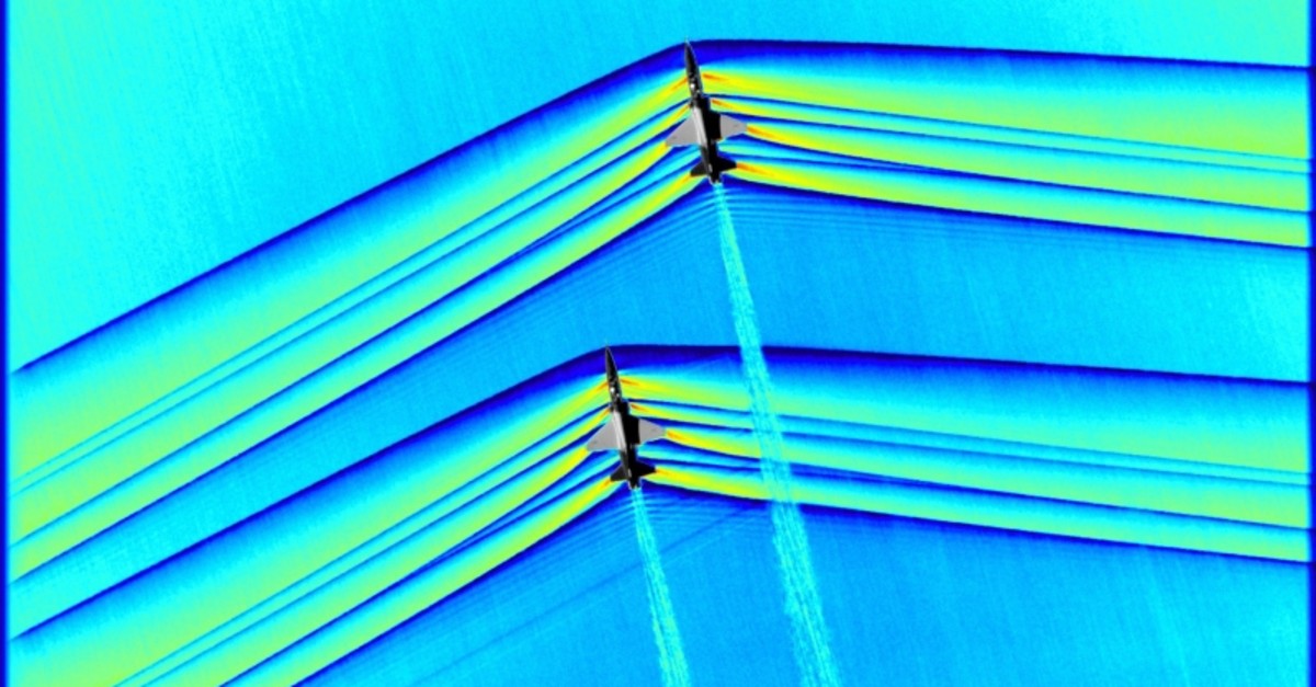 This handout colorized composite image released by NASA on March 5, 2019 shows two T-38 aircrafts flying in formation at supersonic speeds producing shockwaves that are typically heard on the ground as a sonic boom. (AFP Photo)