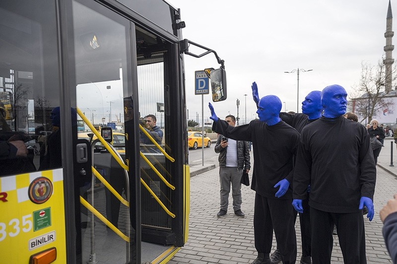 Blue Man Group waves to Istanbul's public transportation users