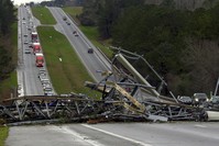 A fallen cell tower lies across U.S. Route 280 highway in Lee County, Ala., in the Smiths Station community after what appeared to be a tornado struck in the area Sunday, March 3, 2019. (AP Photo)