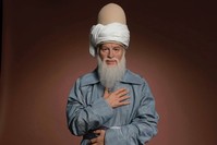 Wax sculpture of Rumi at Madame Tussauds.