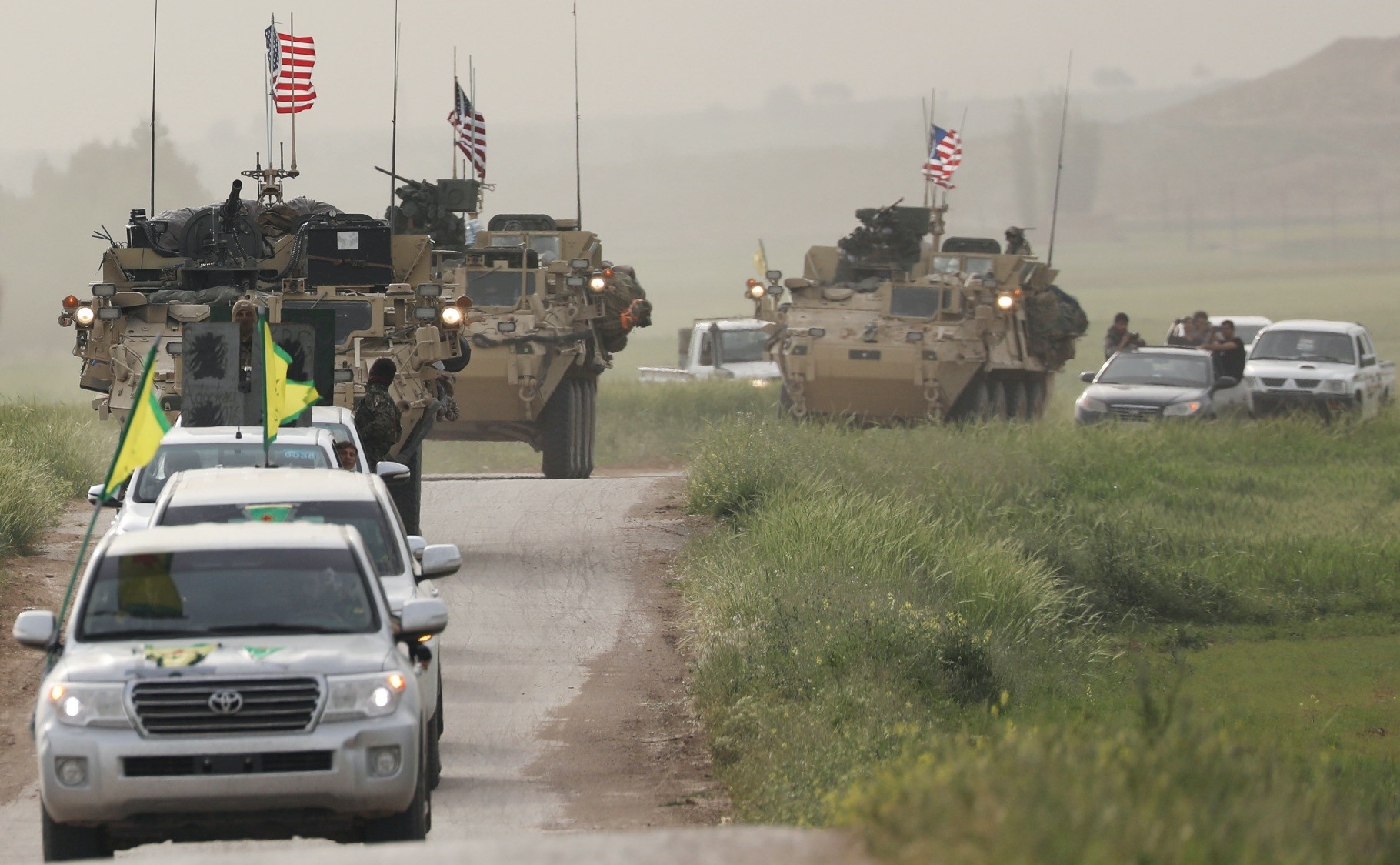 YPG terrorists head a convoy of U.S. military vehicles in the town of Al-Darbasiyah next to the Turkish border, April 28, 2017.