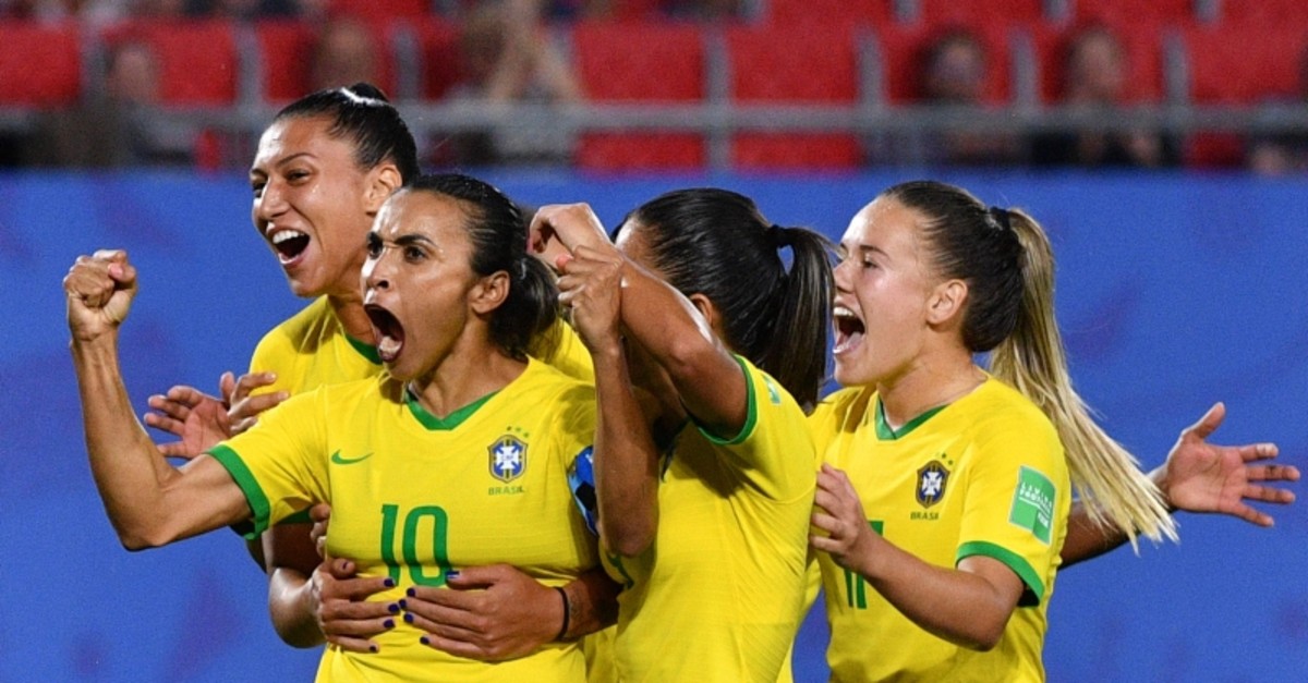 Brazil's forward Marta (2ndL) is congratulated by teammates after scoring a goal during the France 2019 Women's World Cup Group C football match between Italy and Brazil, on June 18, 2019, at the Hainaut Stadium in Valenciennes. (AFP Photo)