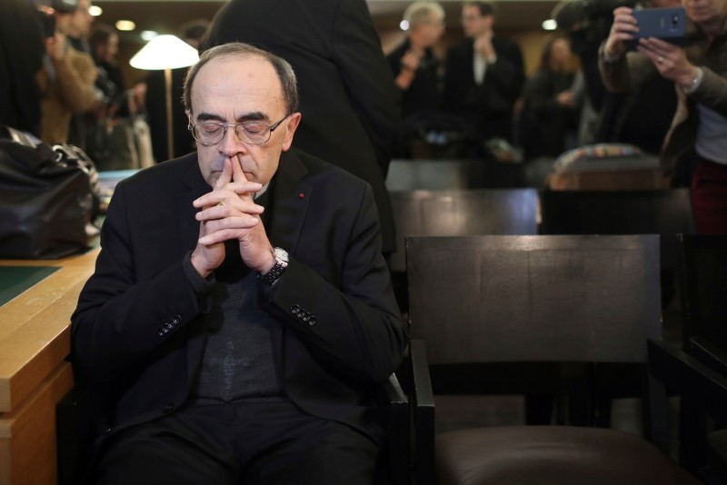 Cardinal Philippe Barbarin waits for the start of his trial at the Lyon courthouse, central France, Monday Jan. 7, 2019. (AP Photo)
