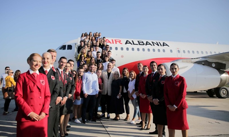 Albanian Prime Minister Edi Rama, Albanian ministers and Turkish Ambassador Murat Ahmet Yu00f6ru00fck pose alongside the staff of the newly-established Air Albania after its maiden flight at the Tirana Mother Teresa Airport, on Sept. 15, 2019. (AA Photo)