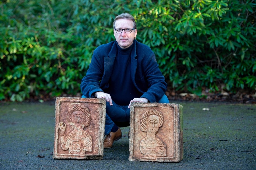 Dutch art detective Arthur Brand poses for a photograph with two limestone Visigoth reliefs from the 7th century in north London on Jan. 20, 2019.