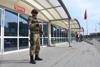 A soldier stands guard outside the courthouse in Silivri, Istanbul where pro-coup troops stand trial for attempting to seize public broadcaster TRT.