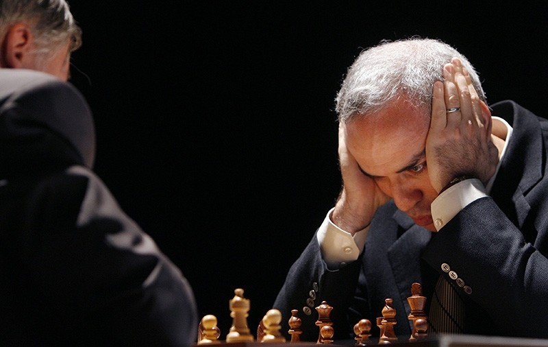 In this Tuesday, Sept. 22, 2009 file photo, former chess world champion Garry Kasparov, right, and Anatoly Karpov, left, play an exhibition rematch in Valencia, Spain. (AP Photo)