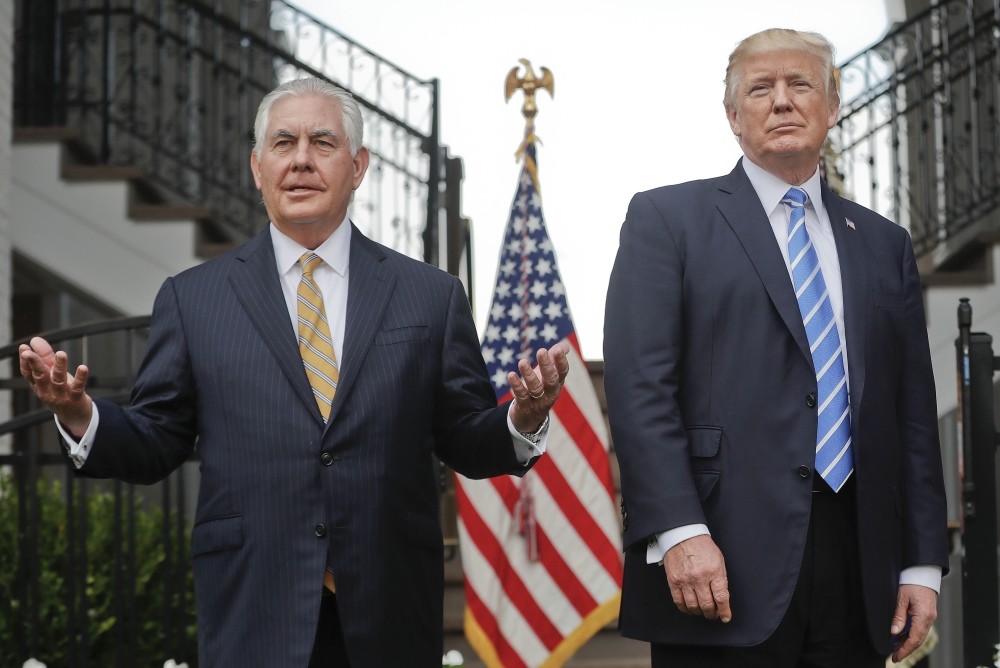 Secretary of State Rex Tillerson, left, speaks following a meeting with President Donald Trump at the Trump National Golf Club in Bedminster, Aug. 11.