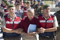 Gendarmerie officers escort Mehmet Diu015fli to court. 