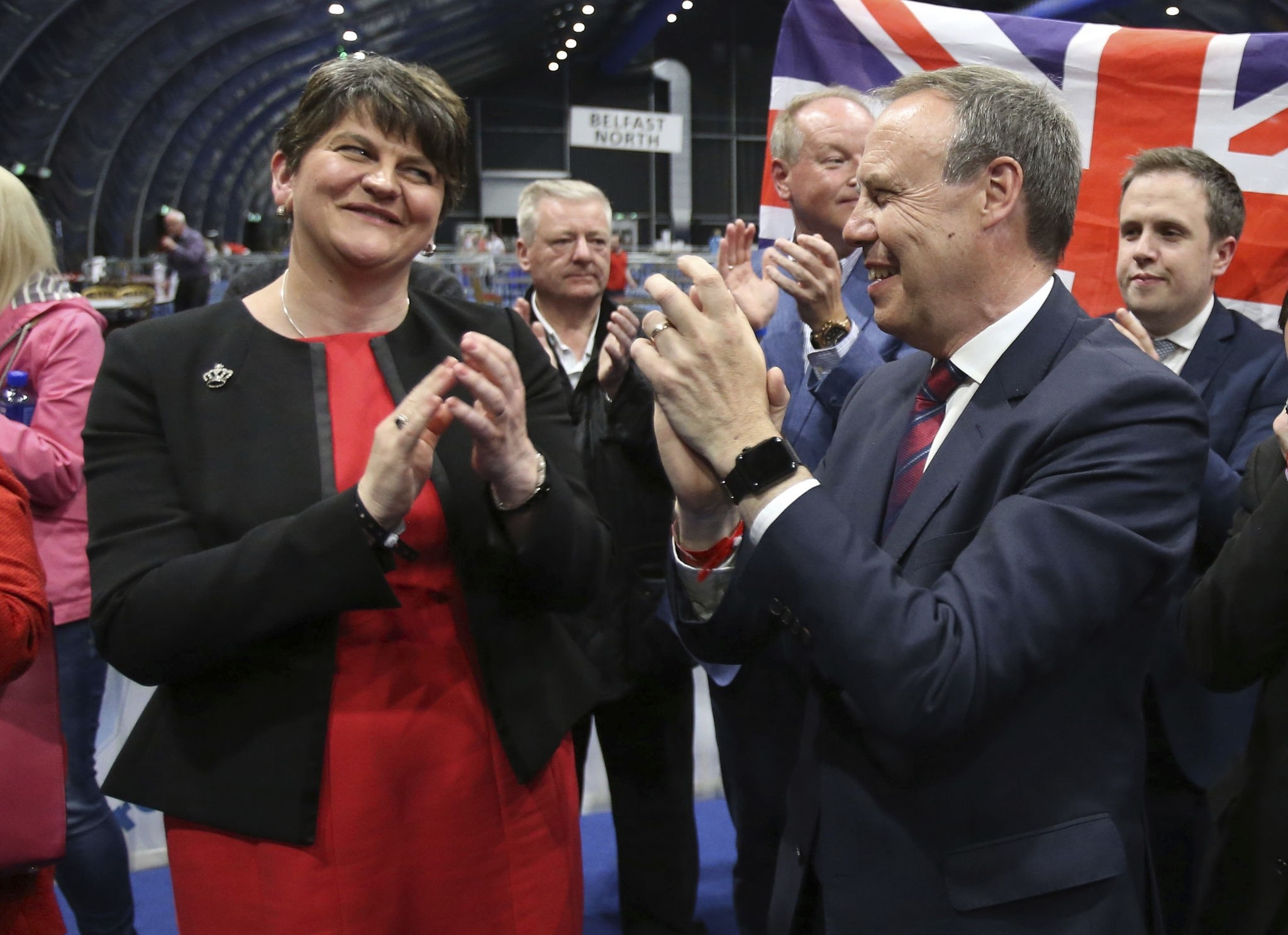 DUP leader Arlene Foster, left, and deputy leader Nigel Dodds cheer as Emma Little Pengelly is elected to the South Belfast constituency on June 9, 2017. (AP Photo)