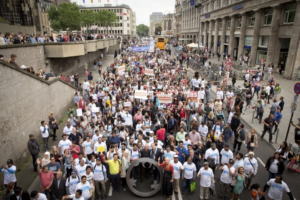 The photo shows people that took part in ,The Not With Us, rally in Cologne, Germany, 17 June. 