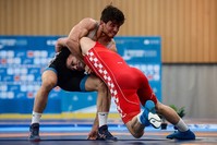 Turkey's Yunus Emre Bau015far (L) wrestles with Croatia's Bozo Starzevic in the men's Greco-Roman 67 Kg semi-final wrestling bout during the wrestling competition of the XVIII Mediterranean Games in Vilaseca near Tarragona on June 24, 2018. (AFP Photo)
