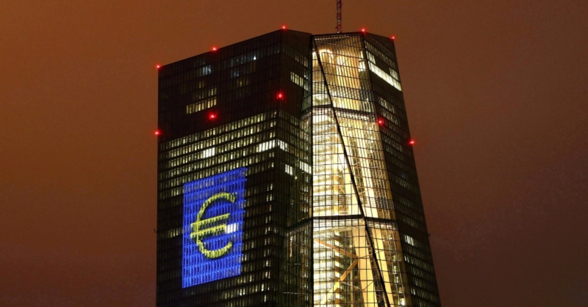 The headquarters of the European Central Bank (ECB) are illuminated with a giant euro sign at the start of the ,Luminale, light and building, event in Frankfurt, Germany, March 12, 2016. (Reuters Photo)