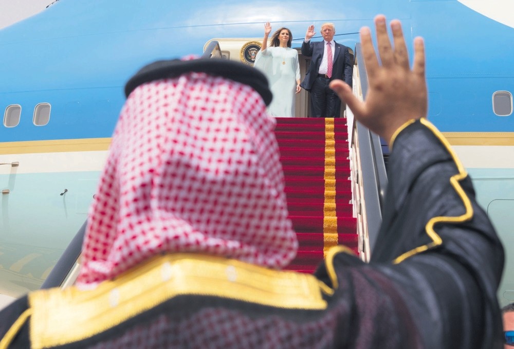 U.S. President Donald Trump and first lady Melania Trump wave to Saudi officials as they board Air Force One before leaving Riyadh for Israel, May 22, 2017.