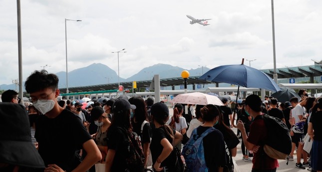 An aircraft takes off as pro-democracy protesters gather outside the airport in, Hong Kong, Sunday, Sept.1, 2019. (AP Photo)