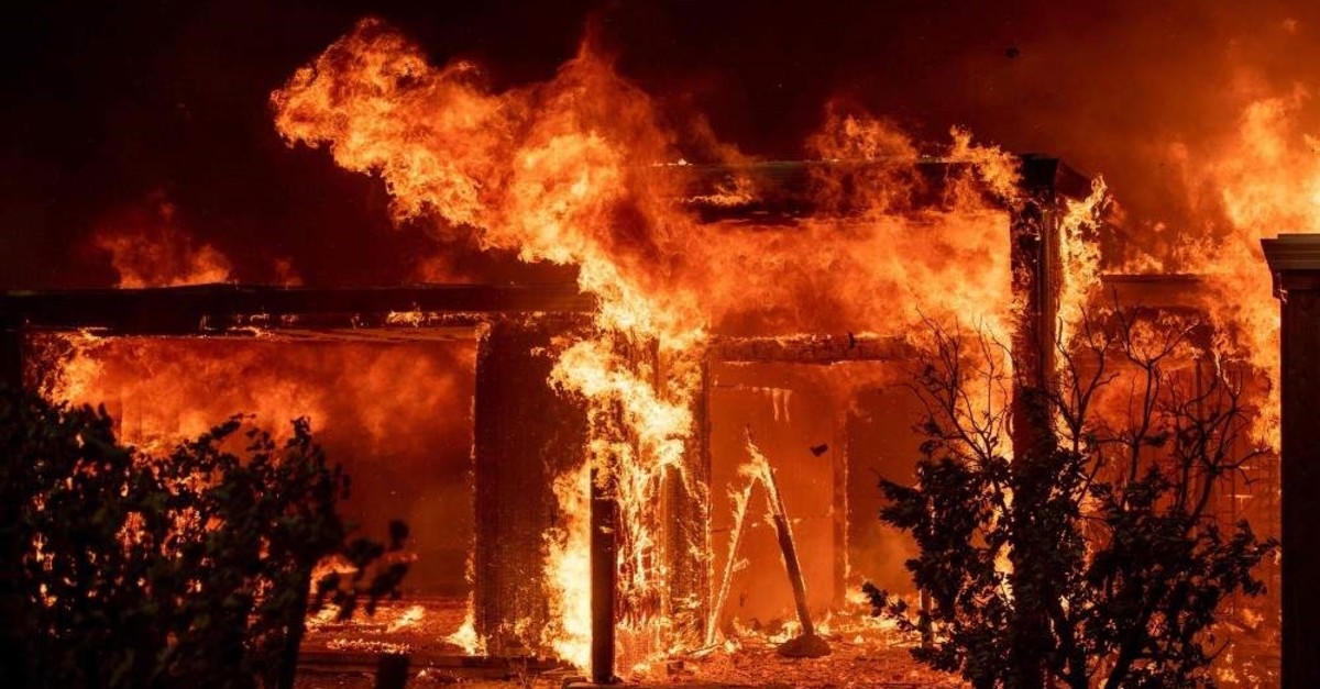 Flames consume a home during the Kincade fire as flames race through Healdsburg, California on October 27, 2019. (AFP Photo)