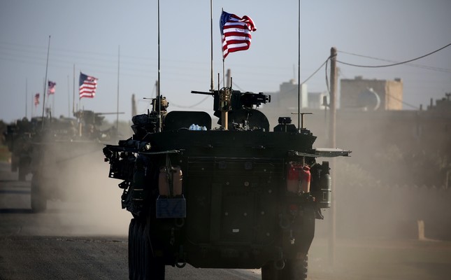 A US military vehicle= drives near the village of Yalanli, on the western outskirts of the northern Syrian city of Manbij, on March 5, 2017.