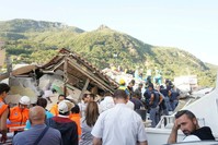 Rescuers at work amongst rubble and damaged houses the day after the earthquake in Ischia, Italy, Aug. 22.