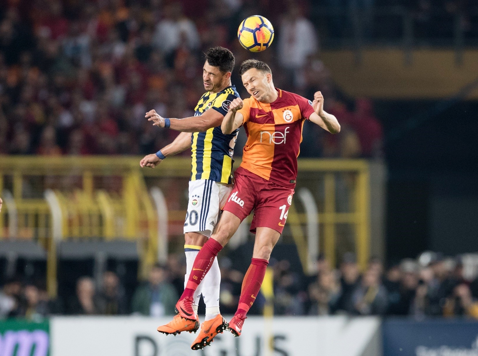 Fenerbahu00e7e's Giuliano Victor De Paula (L) in action against Galatasaray's Martin Linnes during their Super League match in Istanbul.