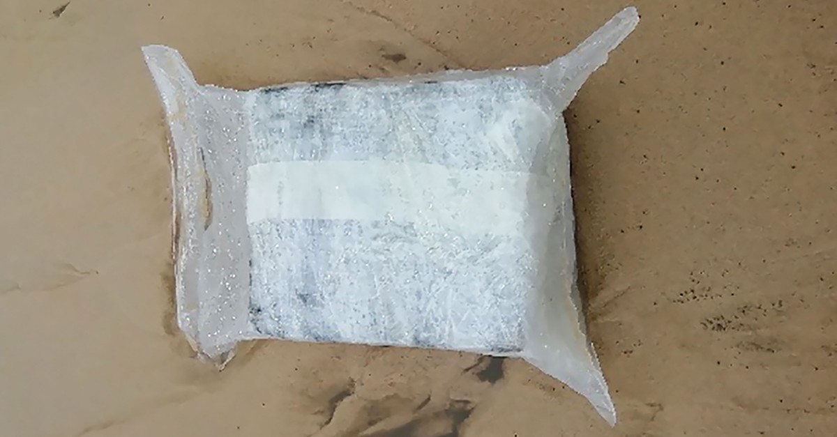 A package allegedly containing cocaine lies on the sand on the Plage du Gressier in Le Porge, southwestern France, Nov. 11, 2019. (AFP Photo)