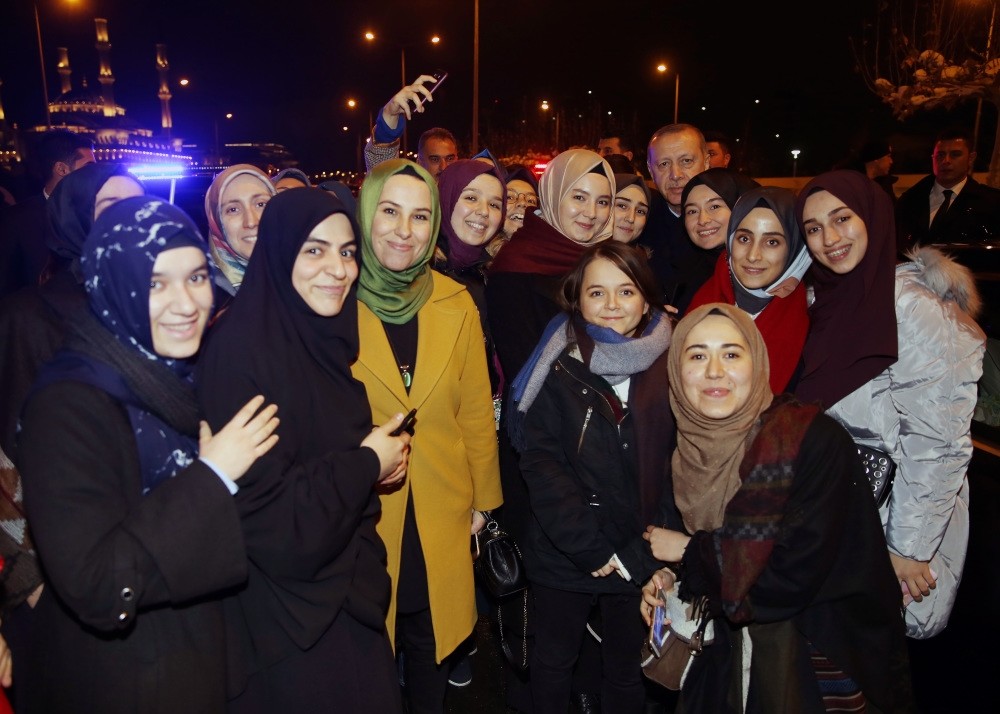 President Recep Tayyip Erdou011fan poses with a group of students during his surprise meeting on Dec. 27 in the capital Ankara.