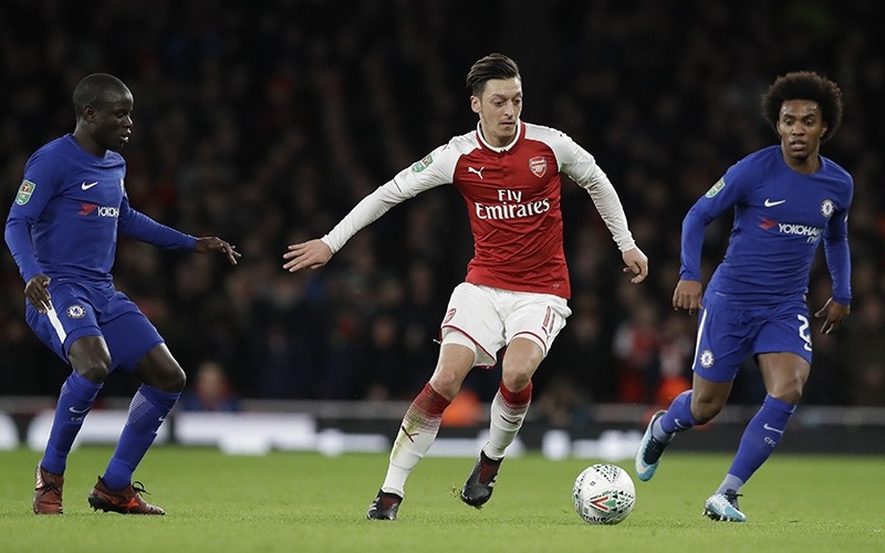 Arsenal's Mesut Ozil controls the ball during the English League Cup semifinal second leg soccer match between Chelsea and Arsenal at the Emirates stadium in London, Wednesday, Jan. 24, 2018. (AP Photo)