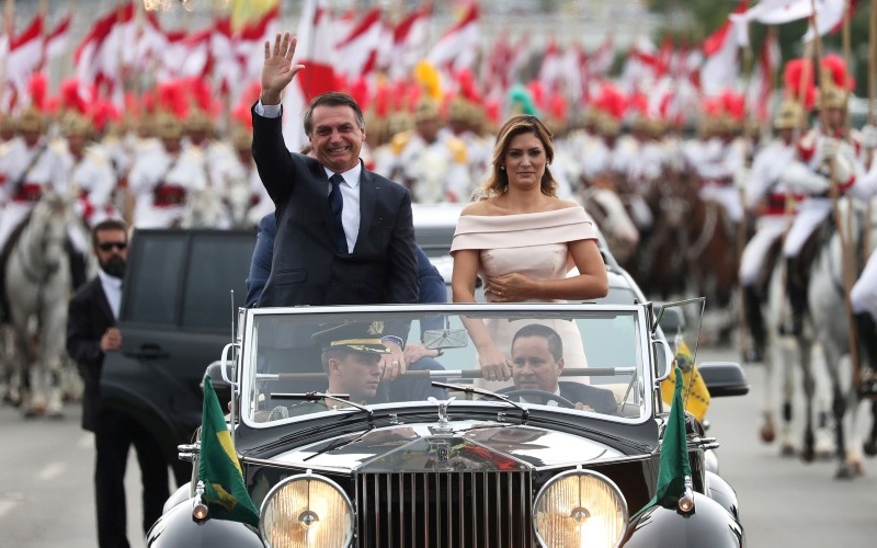 Brazil's new President Jair Bolsonaro waves as he drives past before his swear-in ceremony, in Brasilia, Brazil January 1, 2019. (REUTERS Photo)