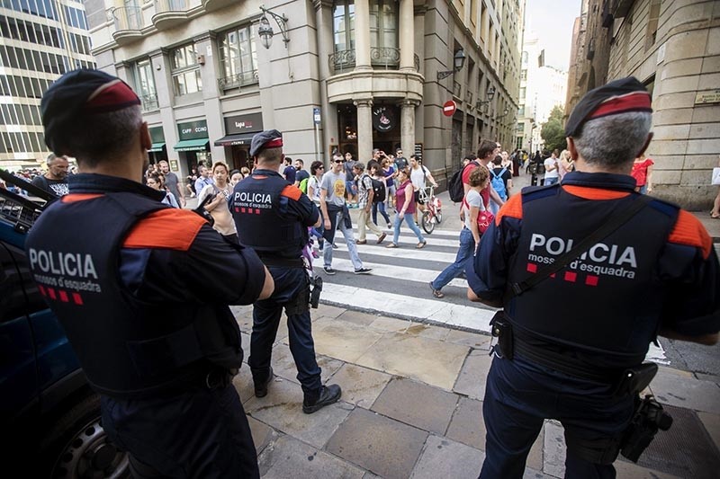  Agents from the Mossos d'Esquadra, Catalonian regional police, on guard in the streets of Barcelona, Spain (EPA Photo)