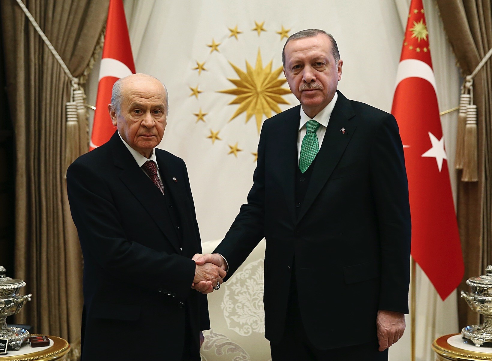 MHP Chairman Bahu00e7eli shakes hands with AK Party chairman, President Recep Tayyip Erdou011fan, before their talks in Ankara, Feb. 18, 2018.