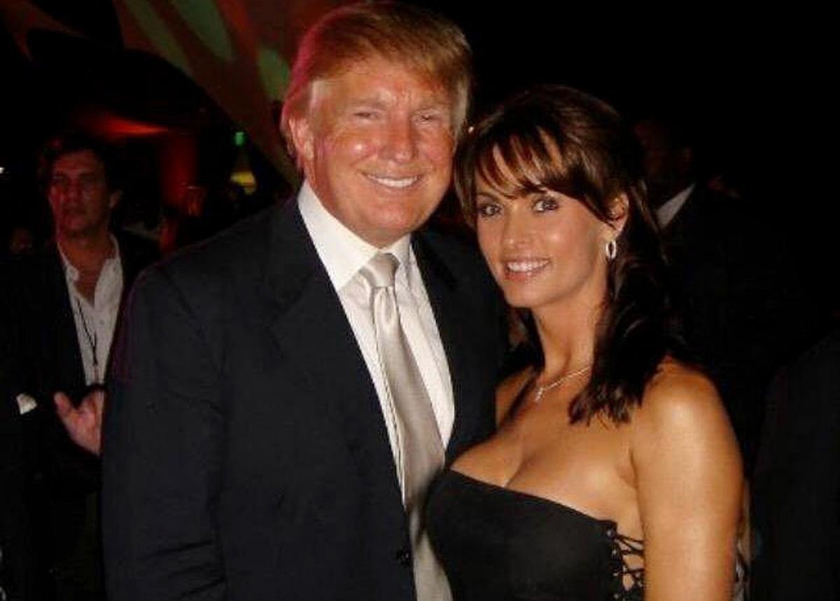 Former Playboy model Karen McDougal poses with Donald Trump in a photo that she posted in 2015 on her Twitter account.