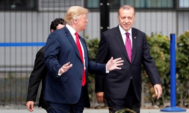 U.S. President Donald Trump, left, chats with President Recep Tayyip Erdogan as they attend for a family picture during a NATO summit in Brussels, Belgium, July 11, 2018. (EPA Photo)