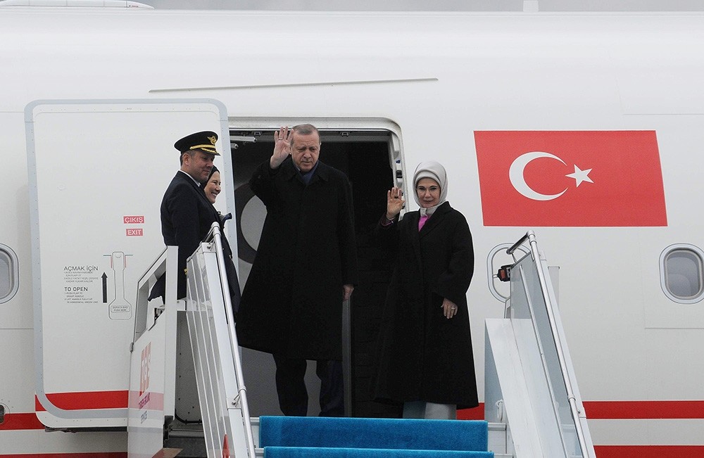 President Recep Tayyip Erdou011fan and First Lady Emine Erdou011fan wave before departing from Istanbul's Atatu00fcrk Airport on Sunday, Feb. 12, 2017. (AA Photo)