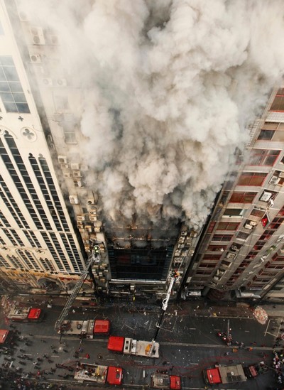 Firefighters work to douse a fire in a multi-storied office building in Dhaka, Bangladesh, Thursday, March 28, 2019. (AP Photo)