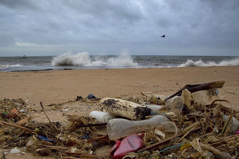 In this Aug. 13, 2015, file photo, a plastic bottle lies among other debris washed ashore on the Indian Ocean beach in Uswetakeiyawa, north of Colombo, Sri Lanka. (AP Photo)