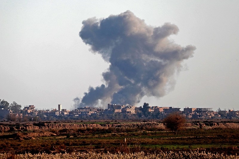 Smoke billows after bombings in the Deir el-Zour province, near Hajin, eastern Syria, on Dec. 15, 2018. (AFP Photo)