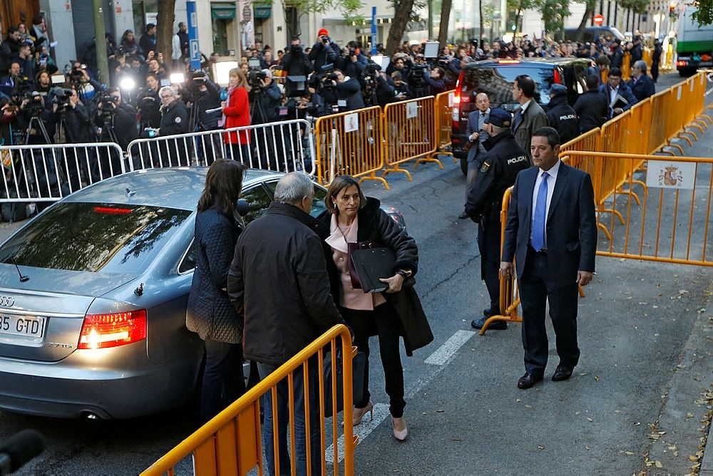 Ex-speaker of the Catalonia parliament Carme Forcadell, center, arrives at the Supreme Court in Madrid, Thursday, Nov. 9, 2017. (AP Photo)