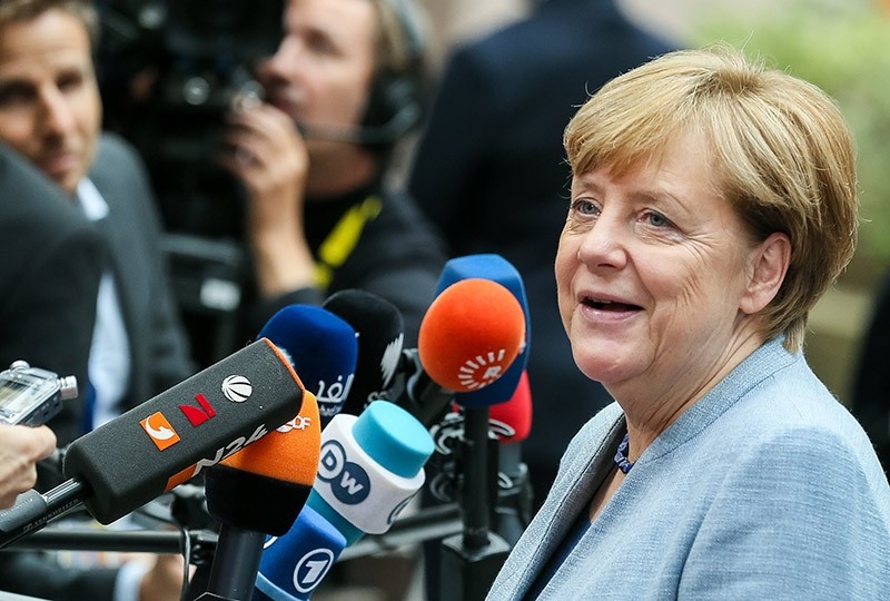 German Chancellor Angela Merkel answers to journalists' questions as she arrives on the first day of the European Council Meeting in Brussels, Oct. 19, 2017 (EPA Photo)