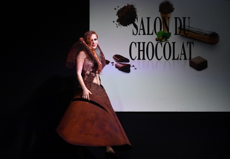 A model presents a chocolate-made dress creation during a fashion show of clothes made out of chocolate for the inaugural night of the sixth Chocolate Fair in Brussels, on February 21, 2019.